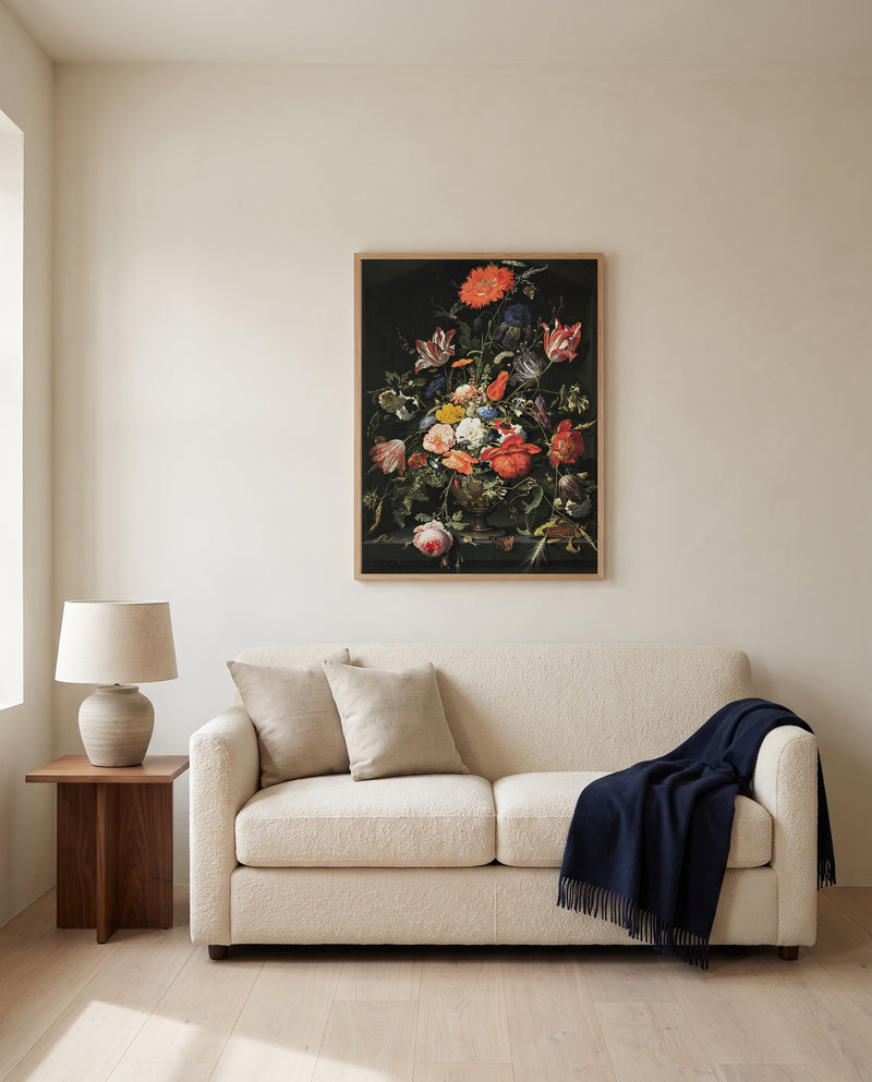 Flowers in a Metal Vase by Abraham Mignon framed in natural oak above a cream sofa in a warm living room