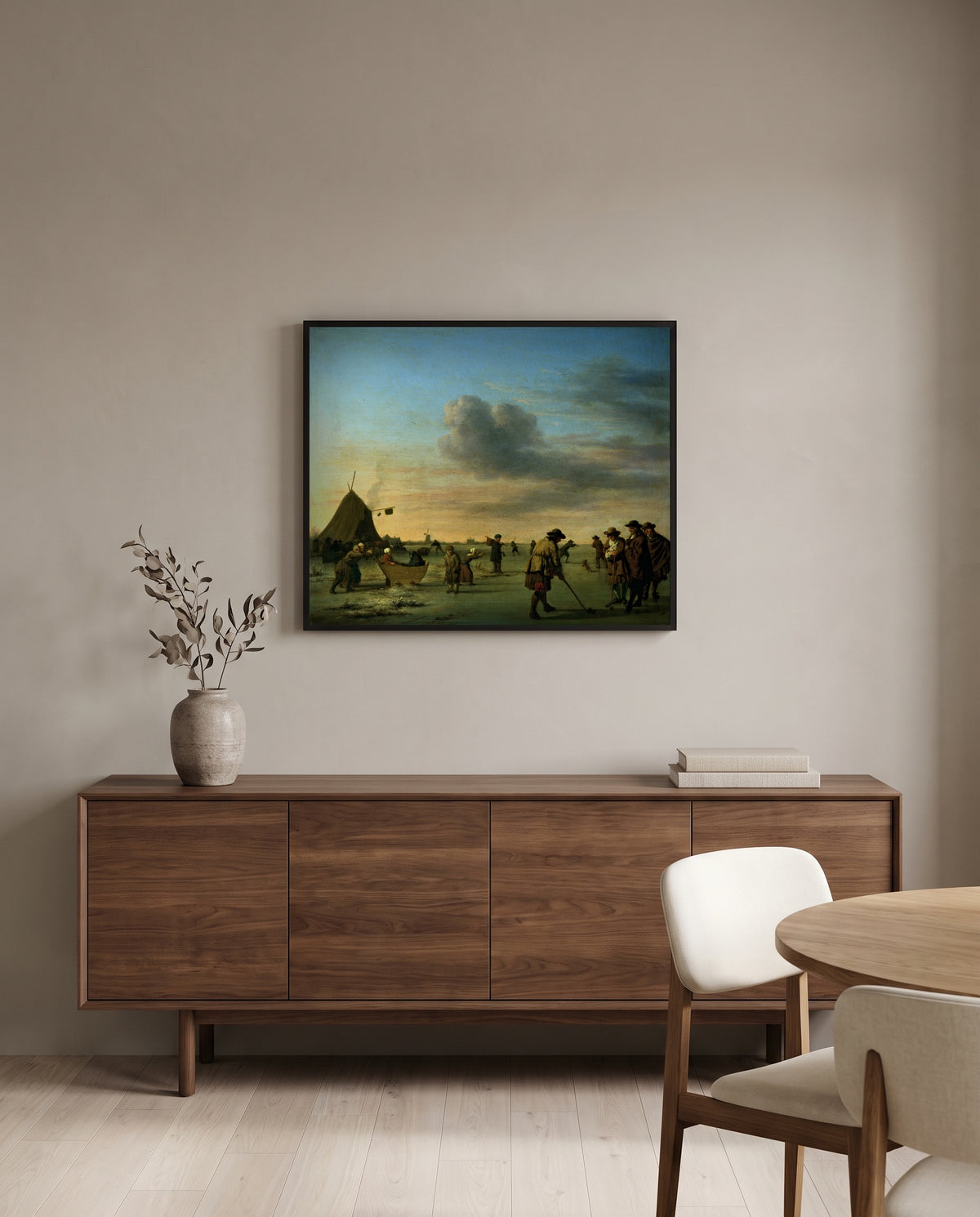 Golfers on the Ice by Adriaen van de Velde in a black frame above a walnut sideboard in a dining room