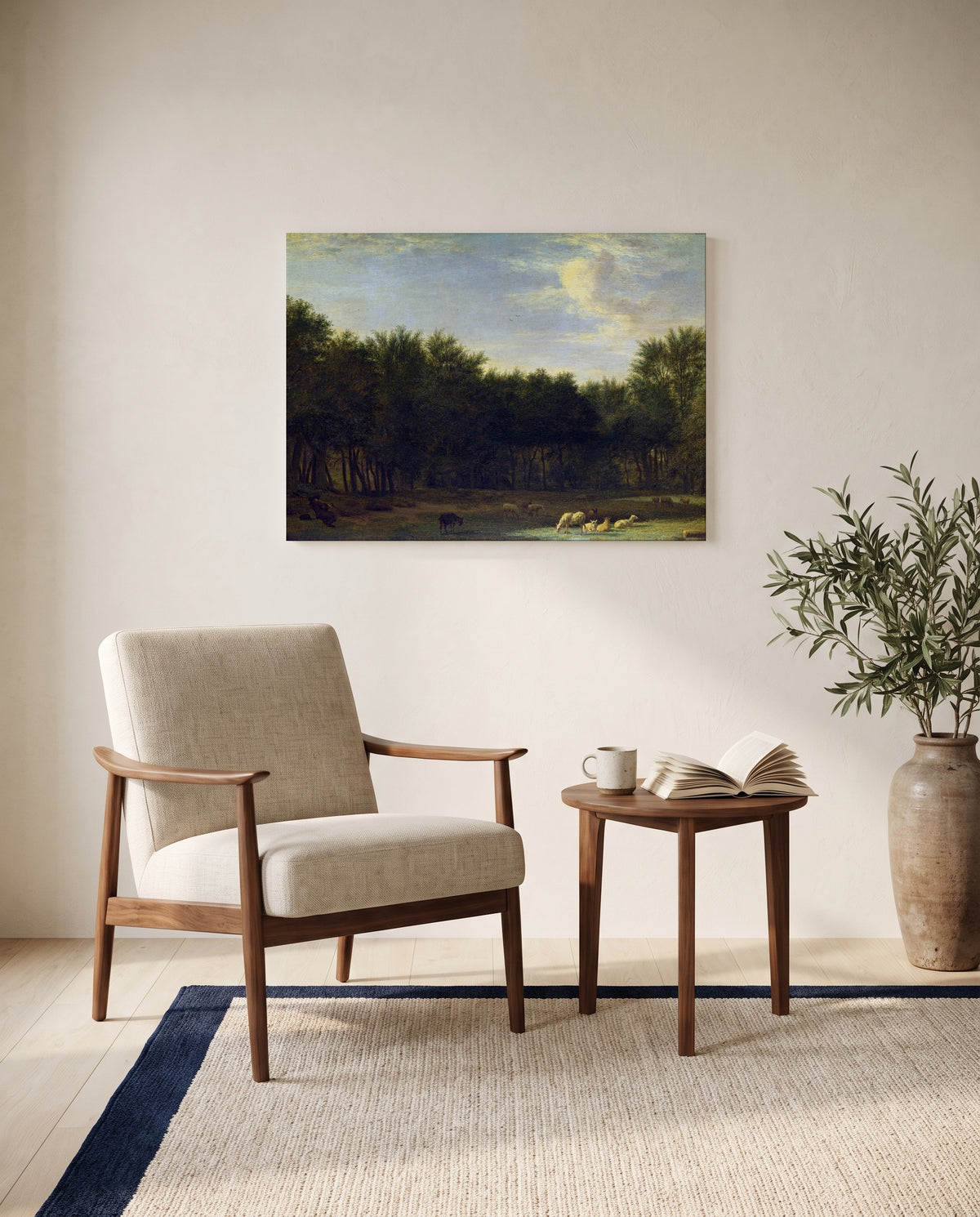 The Edge of a Wood by Adriaen van de Velde as a stretched canvas above a linen lounge chair in a reading corner