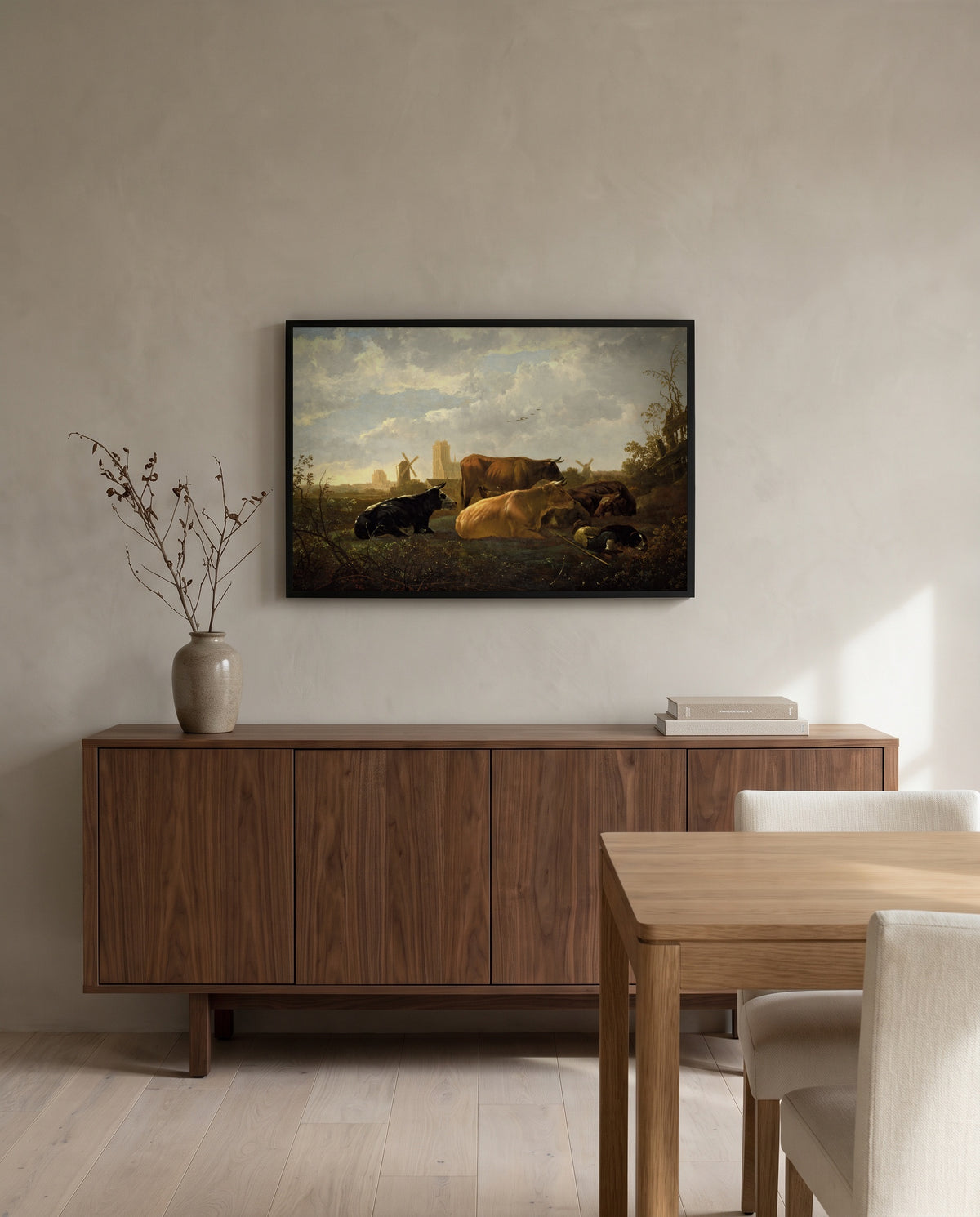 The Small Dort by Aelbert Cuyp in a black frame above a walnut sideboard in a dining room