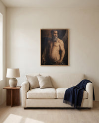 Andrea Doria as Neptune by Agnolo Bronzino framed in natural oak above a cream sofa in a warm living room