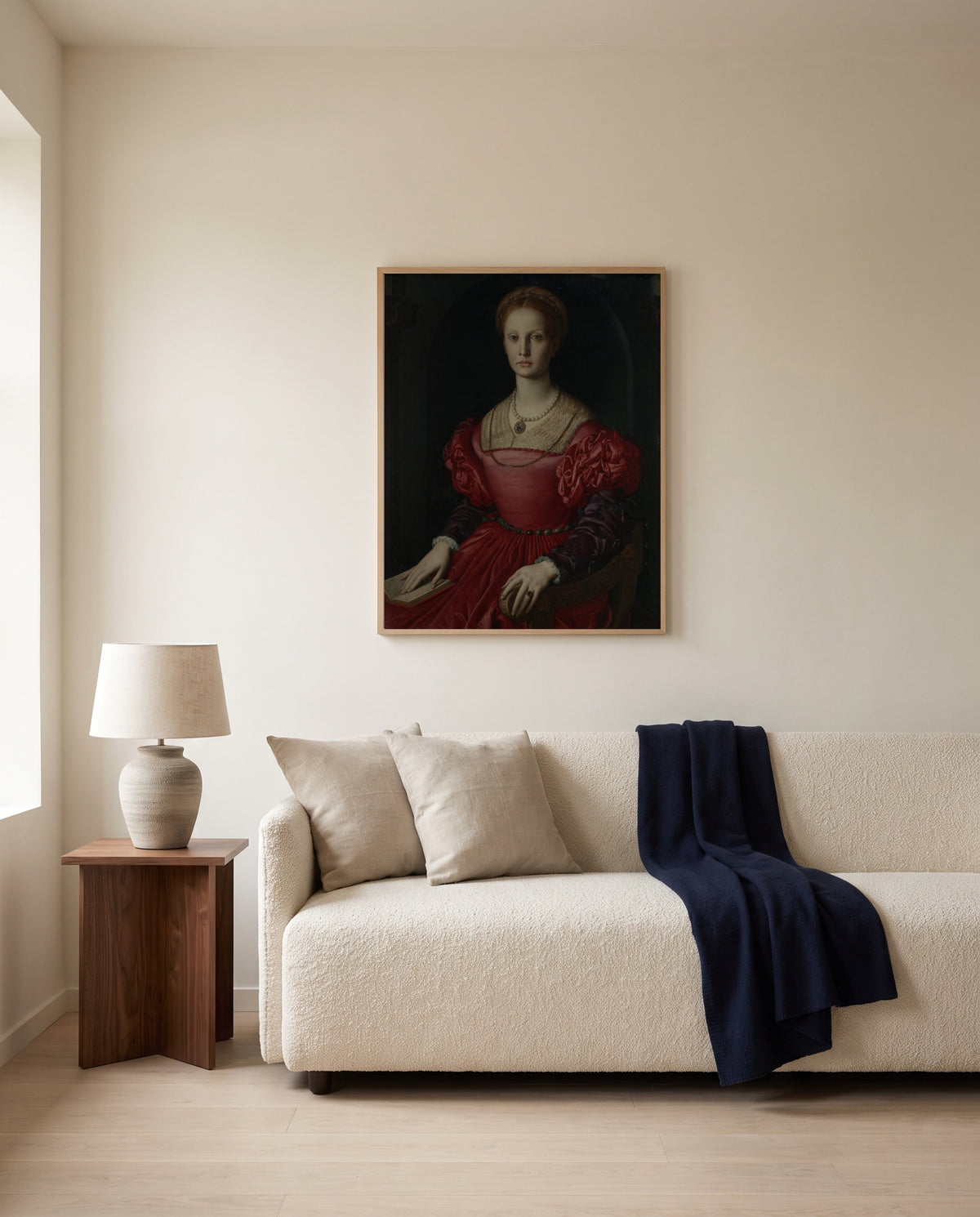 Lucrezia Panciatichi by Agnolo Bronzino framed in natural oak above a cream sofa in a warm living room