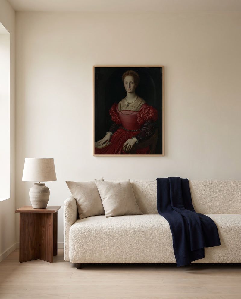Lucrezia Panciatichi by Agnolo Bronzino framed in natural oak above a cream sofa in a warm living room