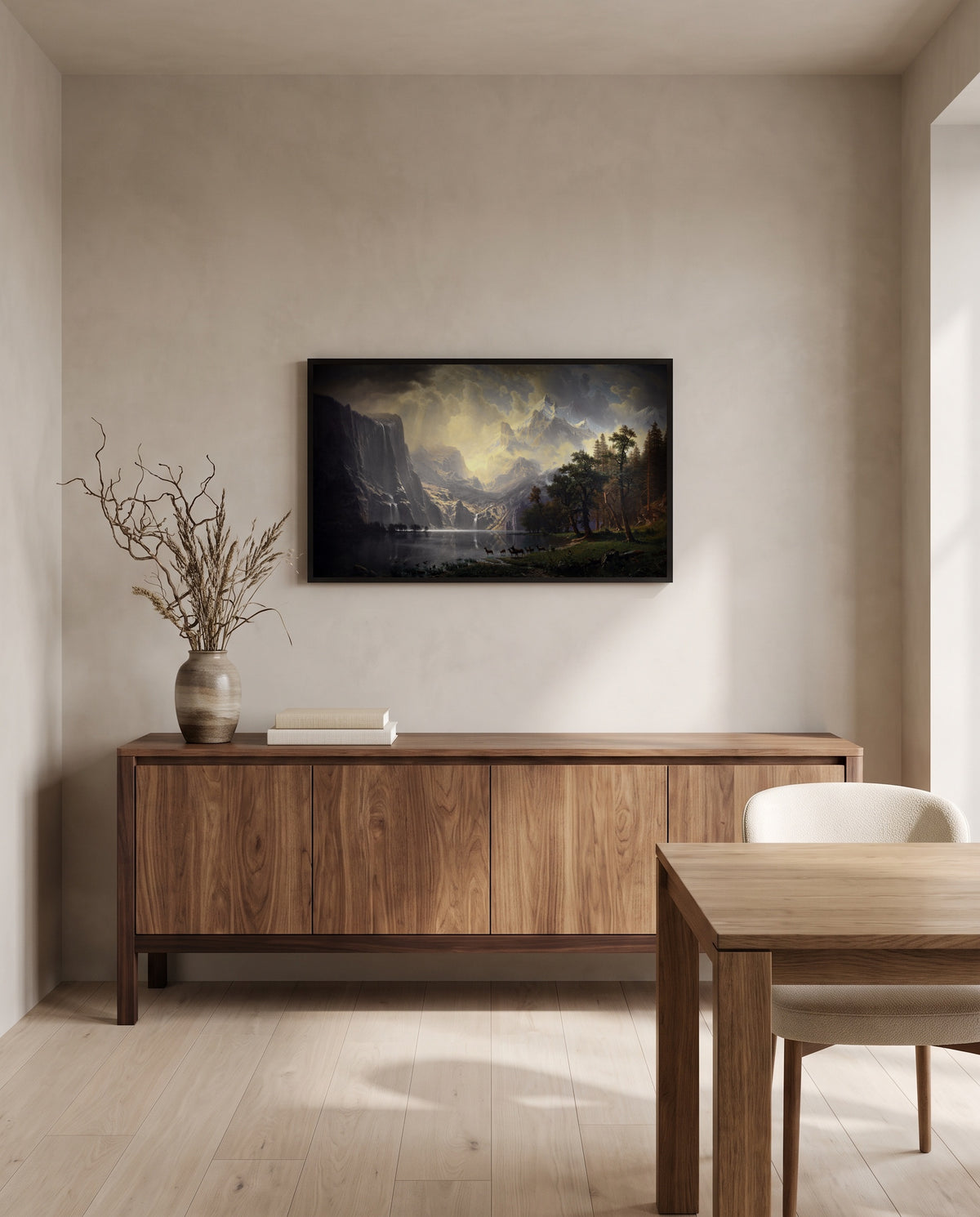 Among the Sierra Nevada by Albert Bierstadt in a black frame above a walnut sideboard in a dining room