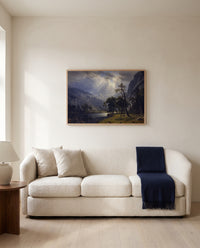 Mount Starr King, Yosemite by Albert Bierstadt framed in natural oak above a cream sofa in a warm living room