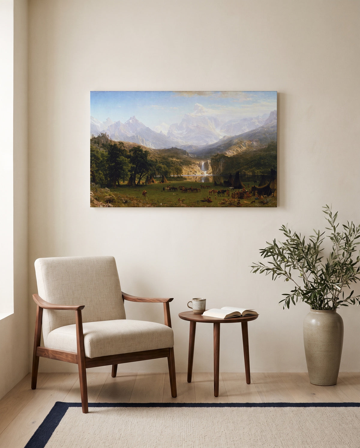 The Rocky Mountains, Lander’s Peak by Albert Bierstadt as a stretched canvas above a linen lounge chair in a reading corner