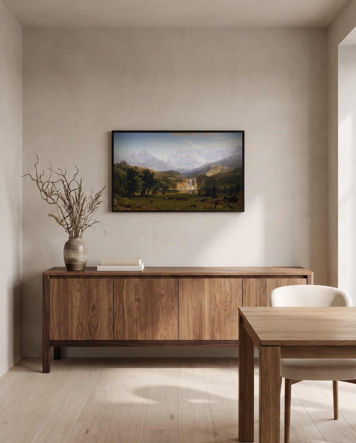 The Rocky Mountains, Lander’s Peak by Albert Bierstadt in a black frame above a walnut sideboard in a dining room