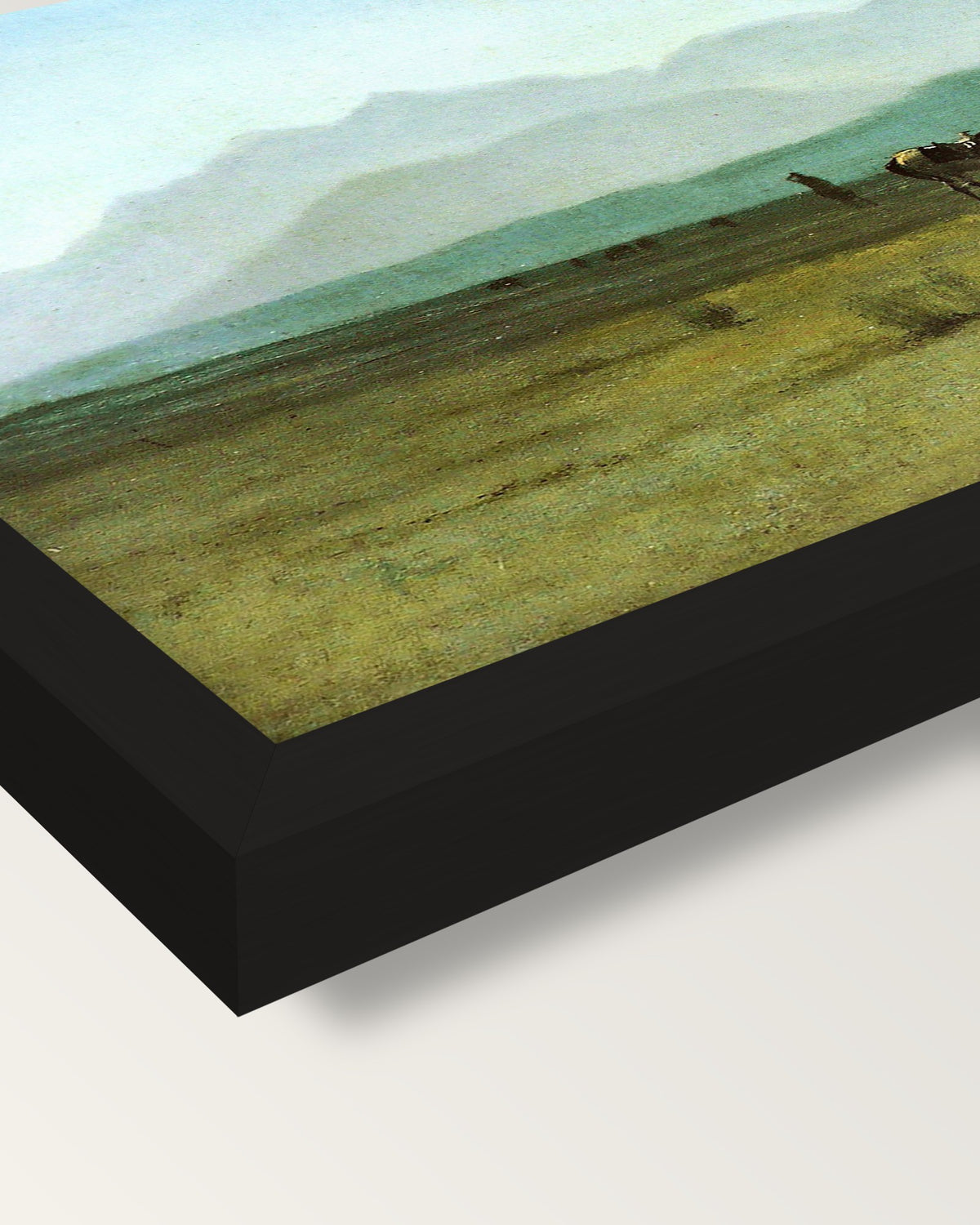 Surveyor’s Wagon in the Rockies framed print, corner close-up: black moulding, mitred, the print set just below its edge