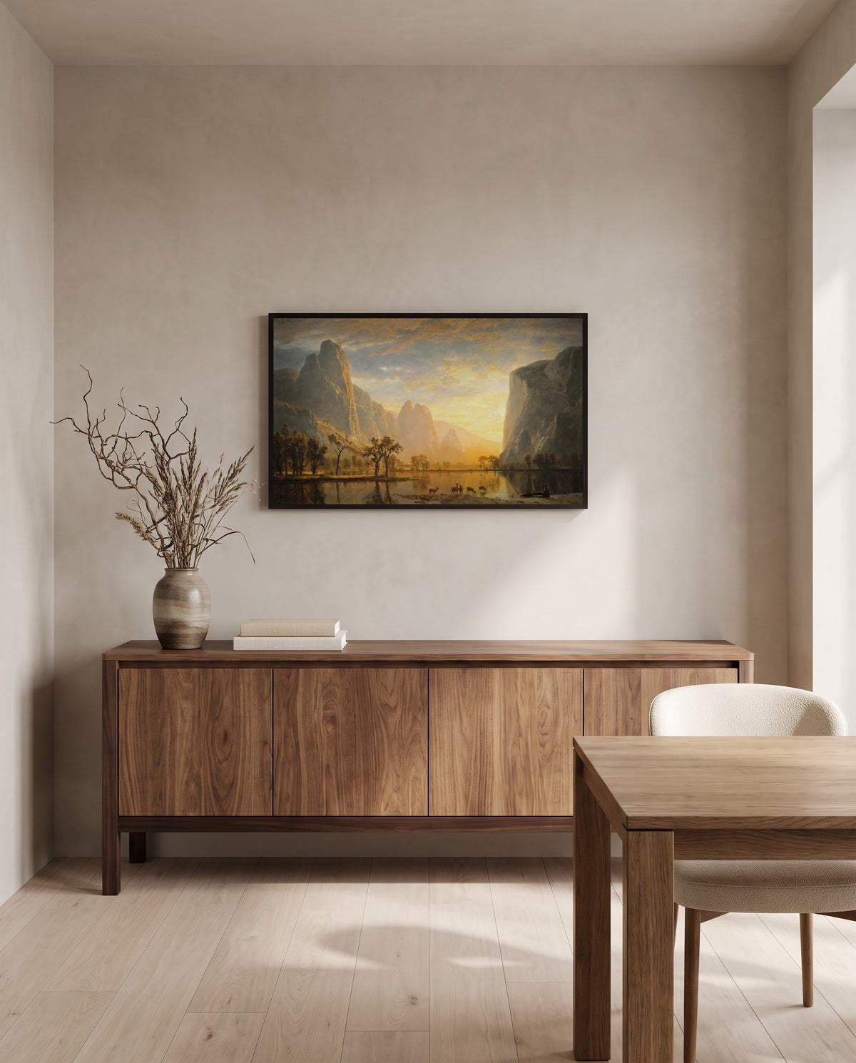 Valley of the Yosemite by Albert Bierstadt in a black frame above a walnut sideboard in a dining room