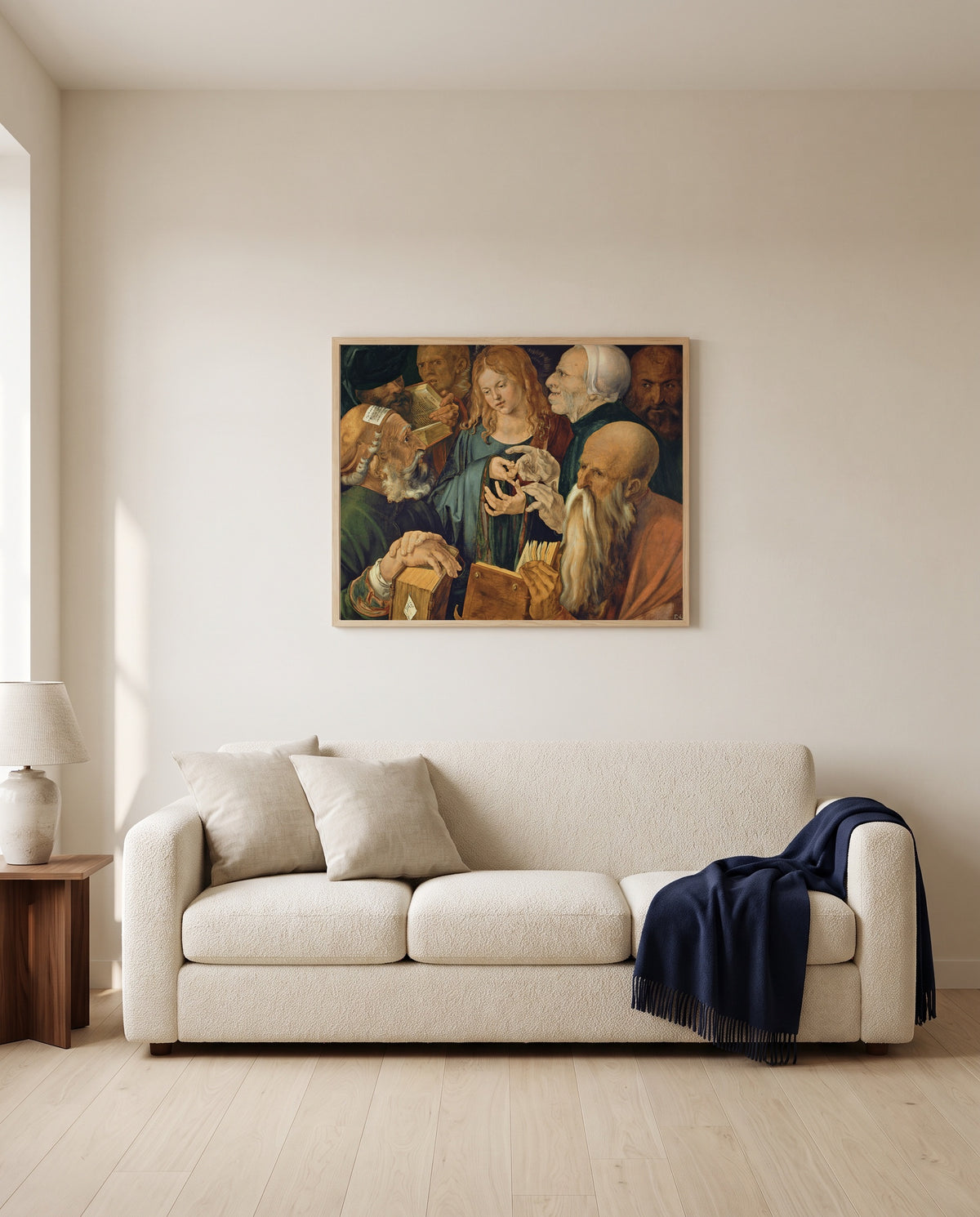 Christ Among the Doctors by Albrecht Dürer framed in natural oak above a cream sofa in a warm living room