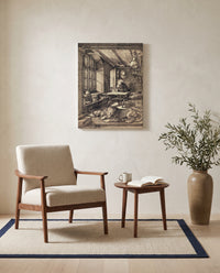 Saint Jerome in His Study by Albrecht Dürer as a stretched canvas above a linen lounge chair in a reading corner