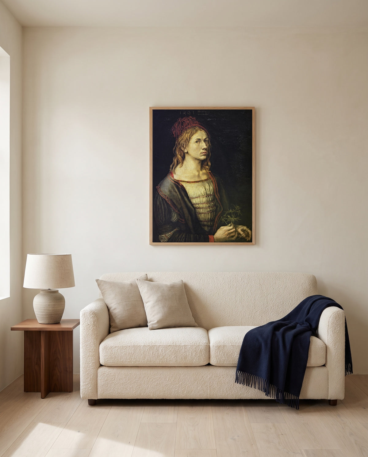 Self-Portrait with Thistle by Albrecht Dürer framed in natural oak above a cream sofa in a warm living room