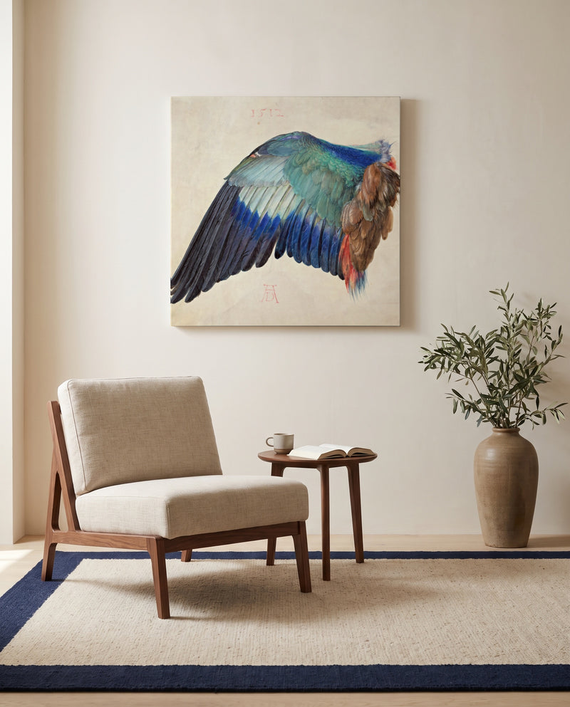 Wing of a European Roller by Albrecht Dürer as a stretched canvas above a linen lounge chair in a reading corner
