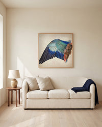 Wing of a European Roller by Albrecht Dürer framed in natural oak above a cream sofa in a warm living room