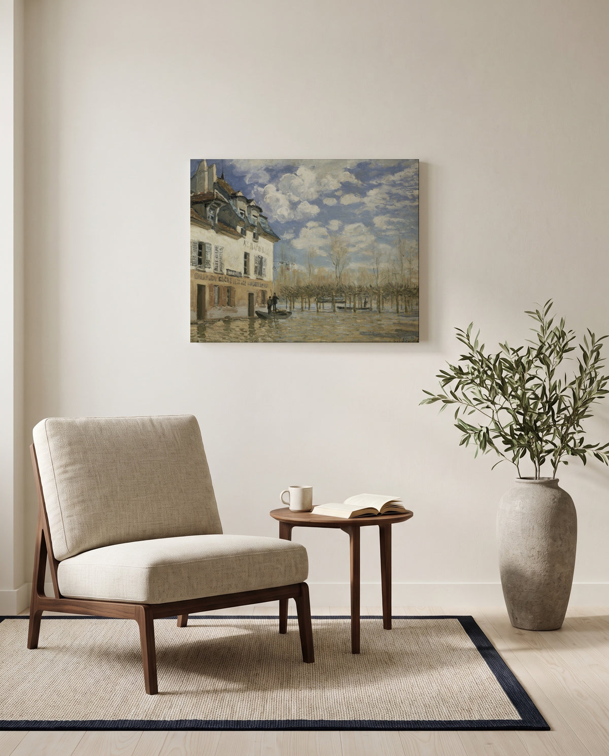 Boat in the Flood by Alfred Sisley as a stretched canvas above a linen lounge chair in a reading corner