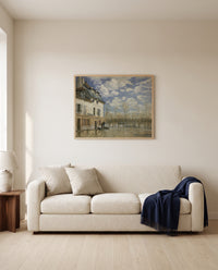 Boat in the Flood by Alfred Sisley framed in natural oak above a cream sofa in a warm living room