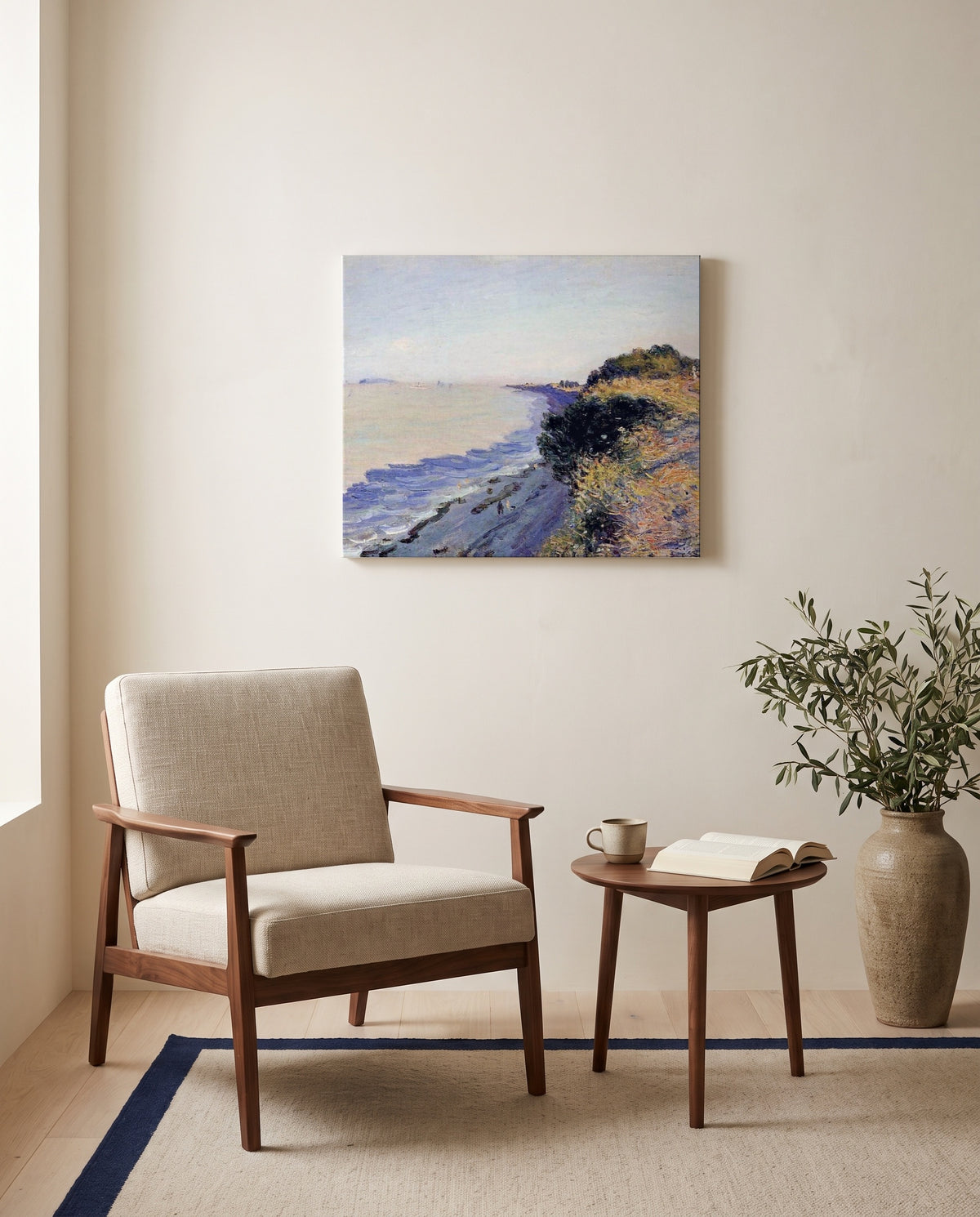 Bristol Channel, Evening by Alfred Sisley as a stretched canvas above a linen lounge chair in a reading corner