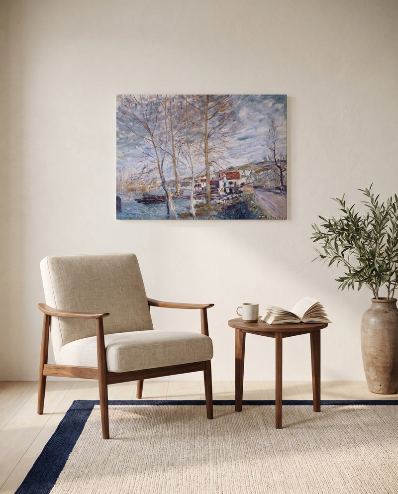 Flood at Moret by Alfred Sisley as a stretched canvas above a linen lounge chair in a reading corner
