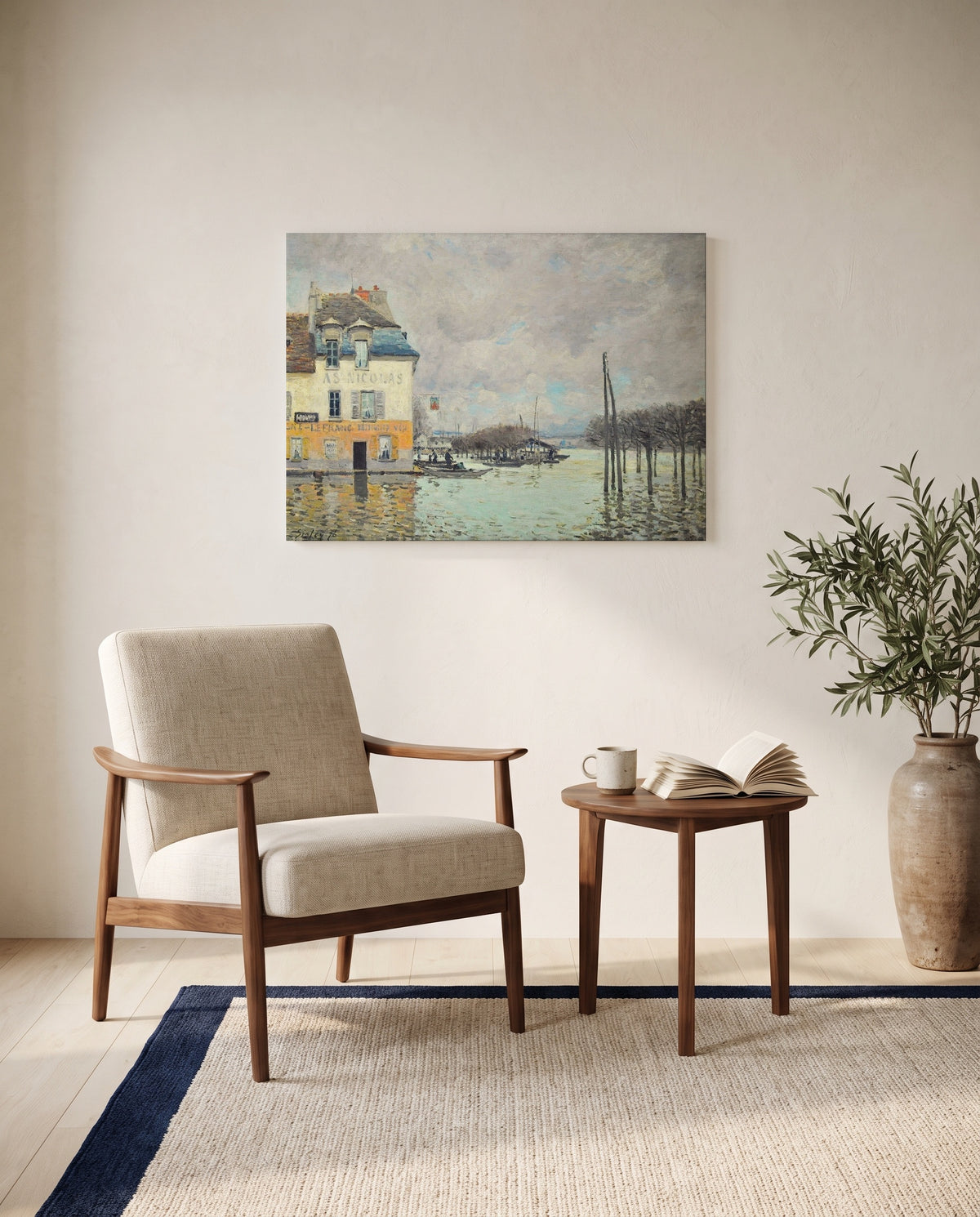 Flood at Port-Marly by Alfred Sisley as a stretched canvas above a linen lounge chair in a reading corner
