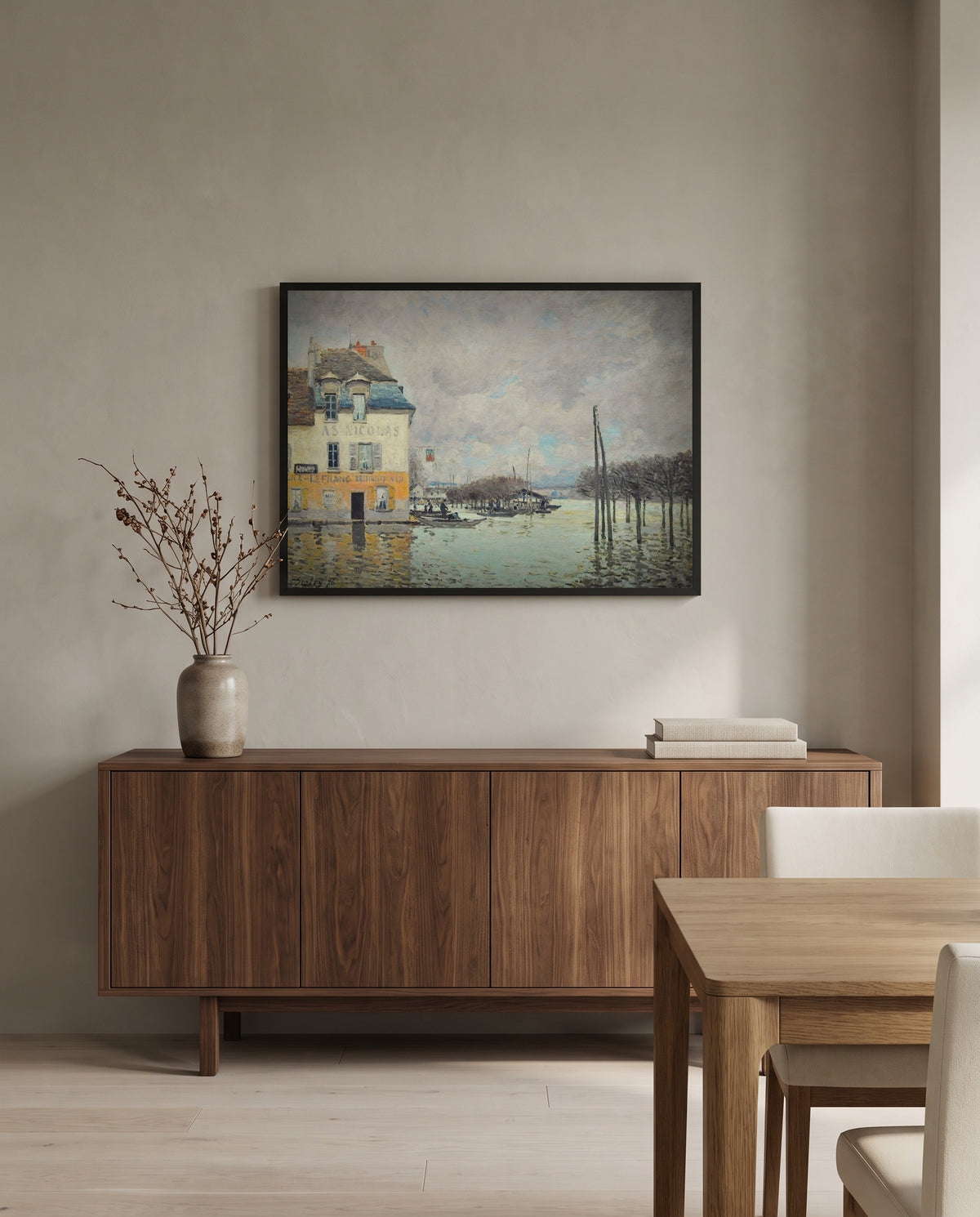 Flood at Port-Marly by Alfred Sisley in a black frame above a walnut sideboard in a dining room
