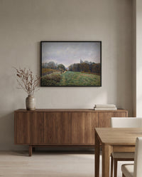 Landscape at Louveciennes by Alfred Sisley in a black frame above a walnut sideboard in a dining room