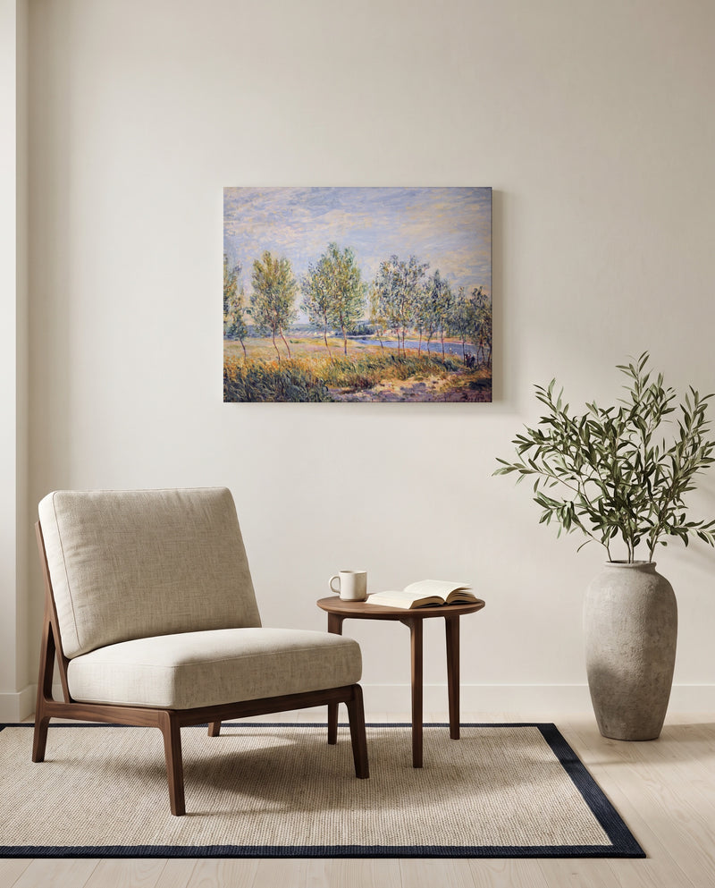 Poplars on a River Bank by Alfred Sisley as a stretched canvas above a linen lounge chair in a reading corner