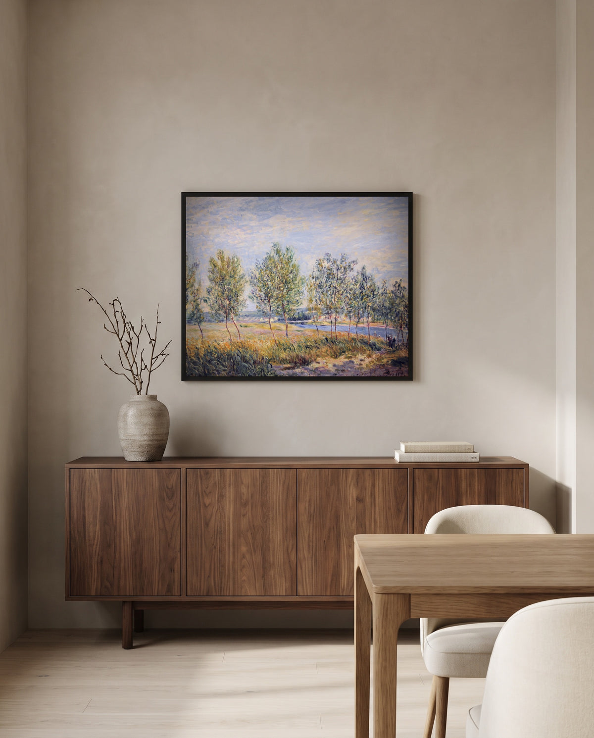 Poplars on a River Bank by Alfred Sisley in a black frame above a walnut sideboard in a dining room