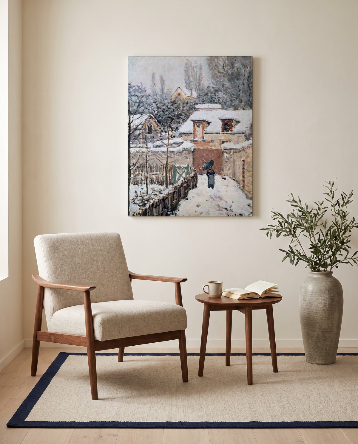 Snow at Louveciennes by Alfred Sisley as a stretched canvas above a linen lounge chair in a reading corner