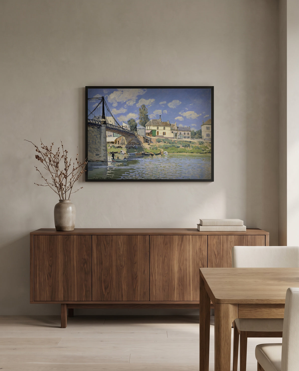 Bridge at Villeneuve by Alfred Sisley in a black frame above a walnut sideboard in a dining room