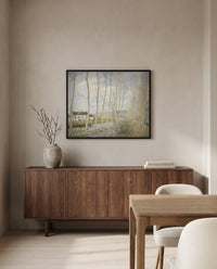 The Canal du Loing by Alfred Sisley in a black frame above a walnut sideboard in a dining room