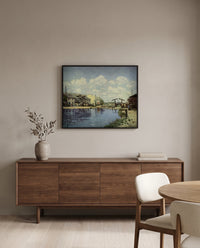 The Canal Saint-Martin by Alfred Sisley in a black frame above a walnut sideboard in a dining room