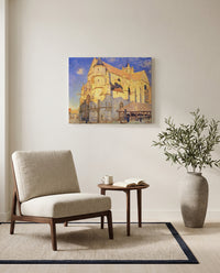 Church at Moret by Alfred Sisley as a stretched canvas above a linen lounge chair in a reading corner