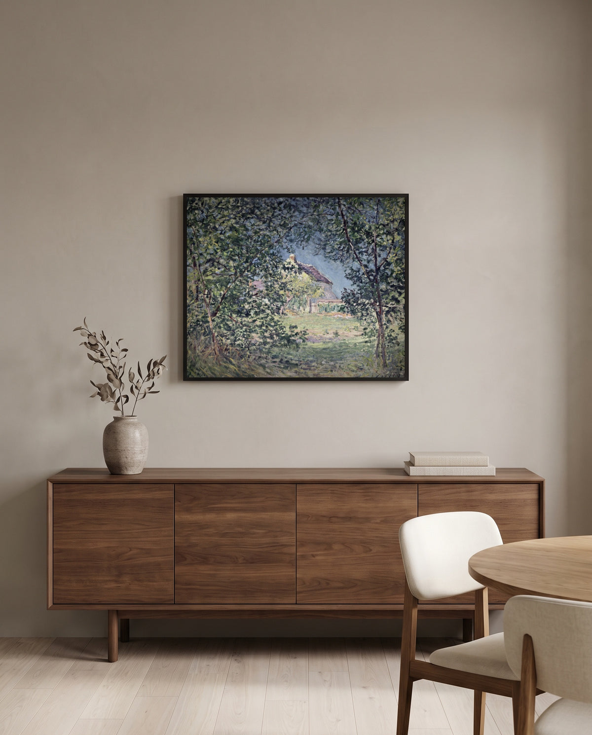 Forest Edge in Spring by Alfred Sisley in a black frame above a walnut sideboard in a dining room