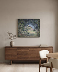 Forest Edge in Spring by Alfred Sisley in a black frame above a walnut sideboard in a dining room