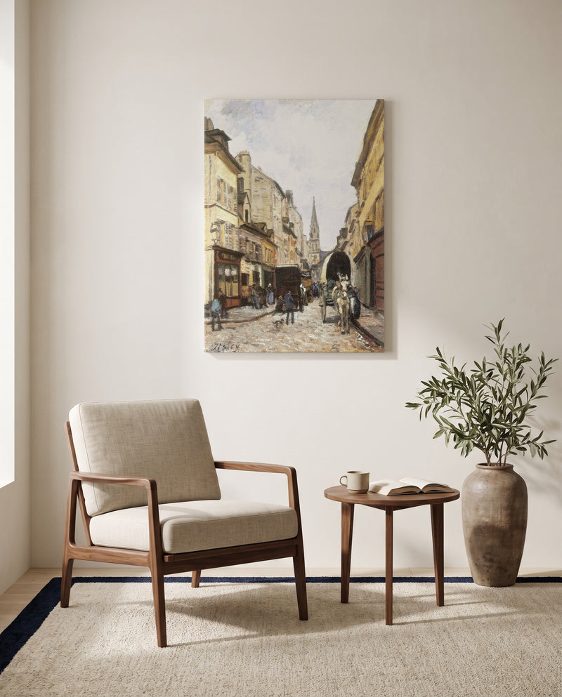 Grand-Rue in Argenteuil by Alfred Sisley as a stretched canvas above a linen lounge chair in a reading corner