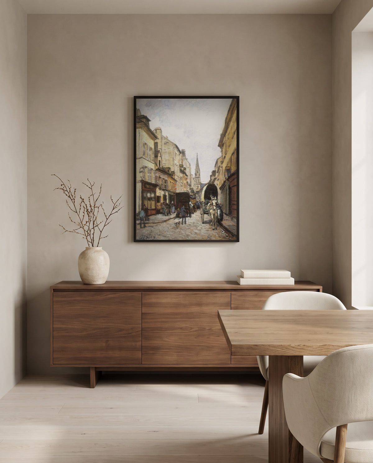 Grand-Rue in Argenteuil by Alfred Sisley in a black frame above a walnut sideboard in a dining room