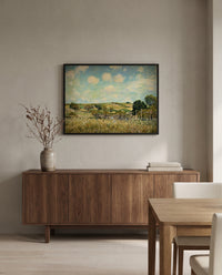 The Meadow by Alfred Sisley in a black frame above a walnut sideboard in a dining room