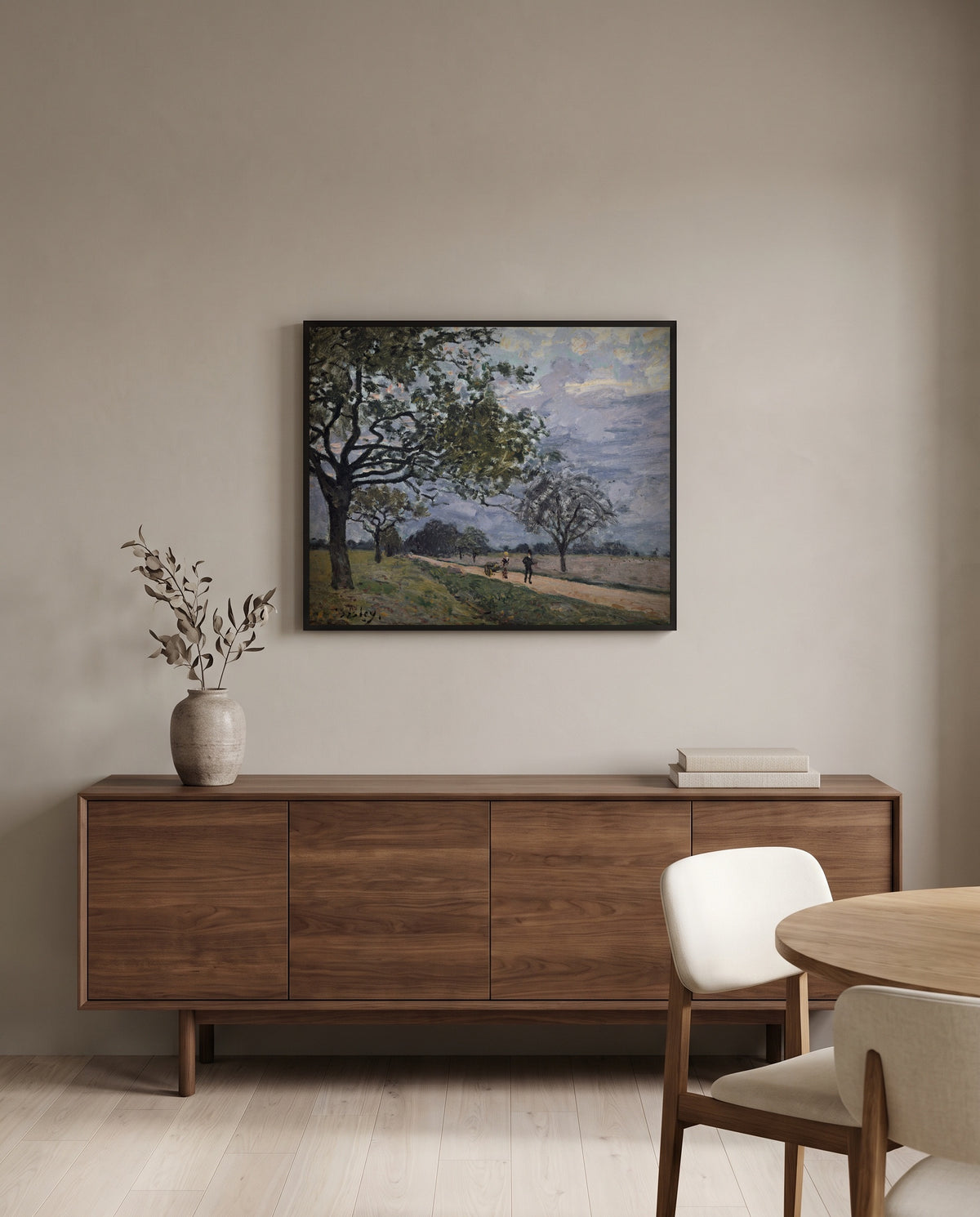 Road to Louveciennes by Alfred Sisley in a black frame above a walnut sideboard in a dining room