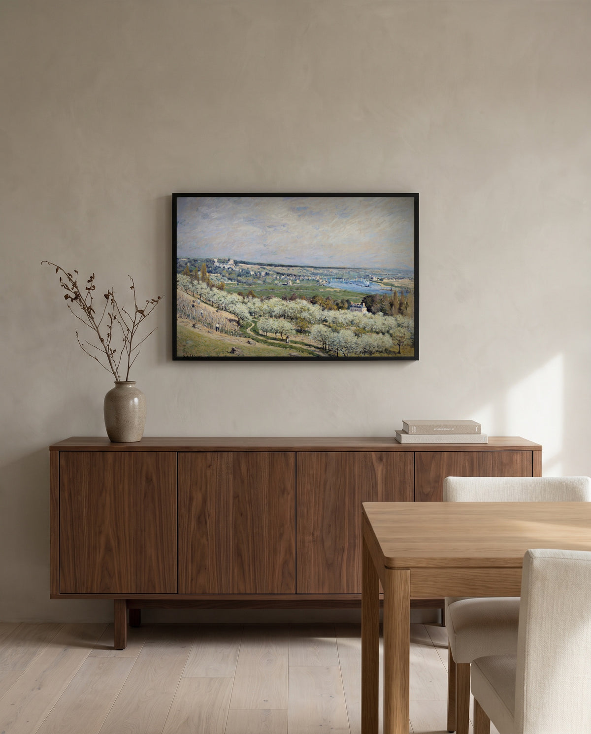 Terrace at Saint-Germain by Alfred Sisley in a black frame above a walnut sideboard in a dining room