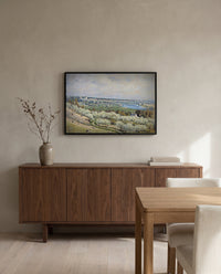 Terrace at Saint-Germain by Alfred Sisley in a black frame above a walnut sideboard in a dining room