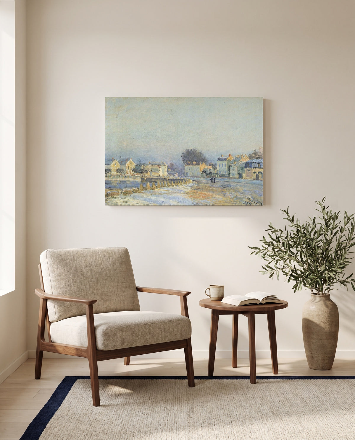 Watering Pond at Marly by Alfred Sisley as a stretched canvas above a linen lounge chair in a reading corner