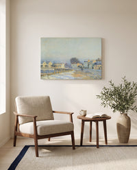 Watering Pond at Marly by Alfred Sisley as a stretched canvas above a linen lounge chair in a reading corner