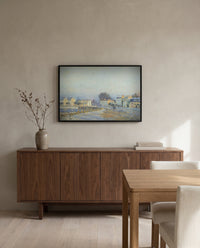 Watering Pond at Marly by Alfred Sisley in a black frame above a walnut sideboard in a dining room