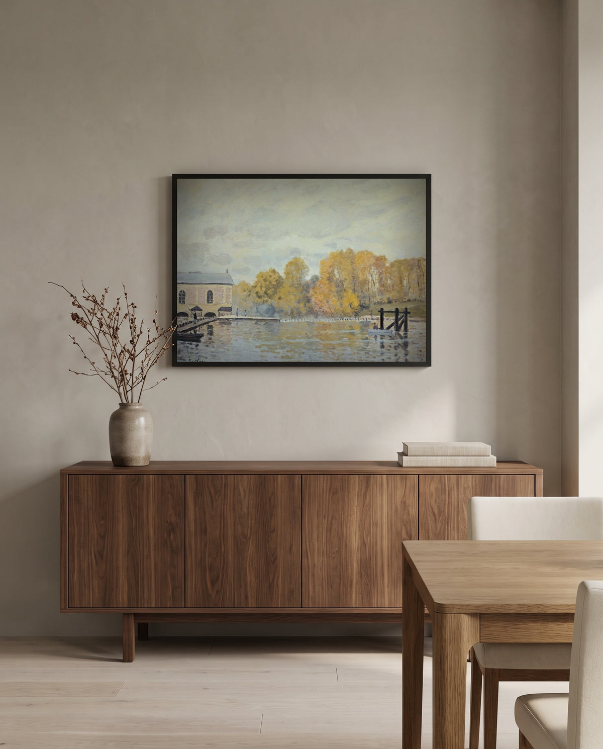 Waterworks at Marly by Alfred Sisley in a black frame above a walnut sideboard in a dining room