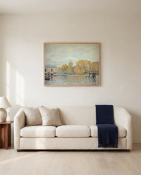 Waterworks at Marly by Alfred Sisley framed in natural oak above a cream sofa in a warm living room