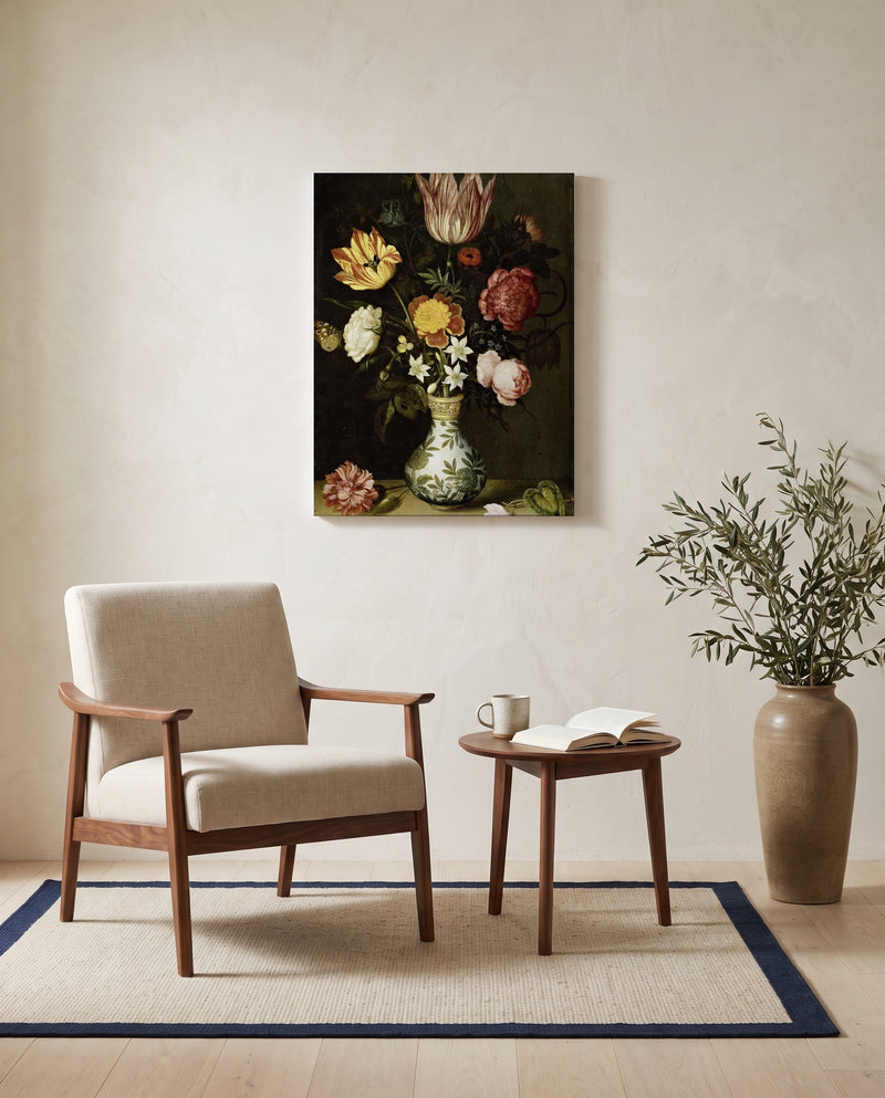 Flowers in a Wan-Li Vase by the Elder as a stretched canvas above a linen lounge chair in a reading corner