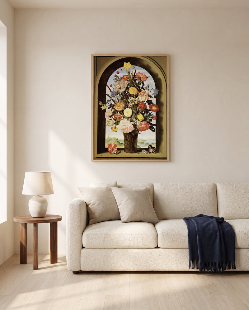 Vase of Flowers in a Niche by Ambrosius Bosschaert the Elder framed in natural oak above a cream sofa in a warm living room