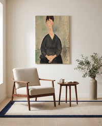 Café Singer by Amedeo Modigliani as a stretched canvas above a linen lounge chair in a reading corner