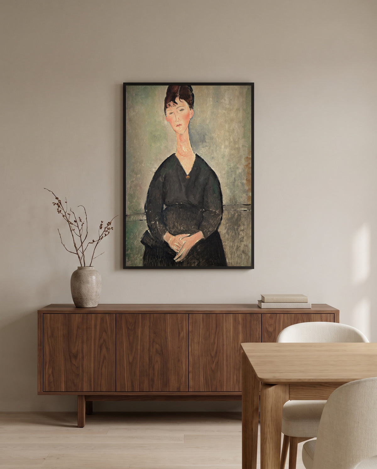 Café Singer by Amedeo Modigliani in a black frame above a walnut sideboard in a dining room