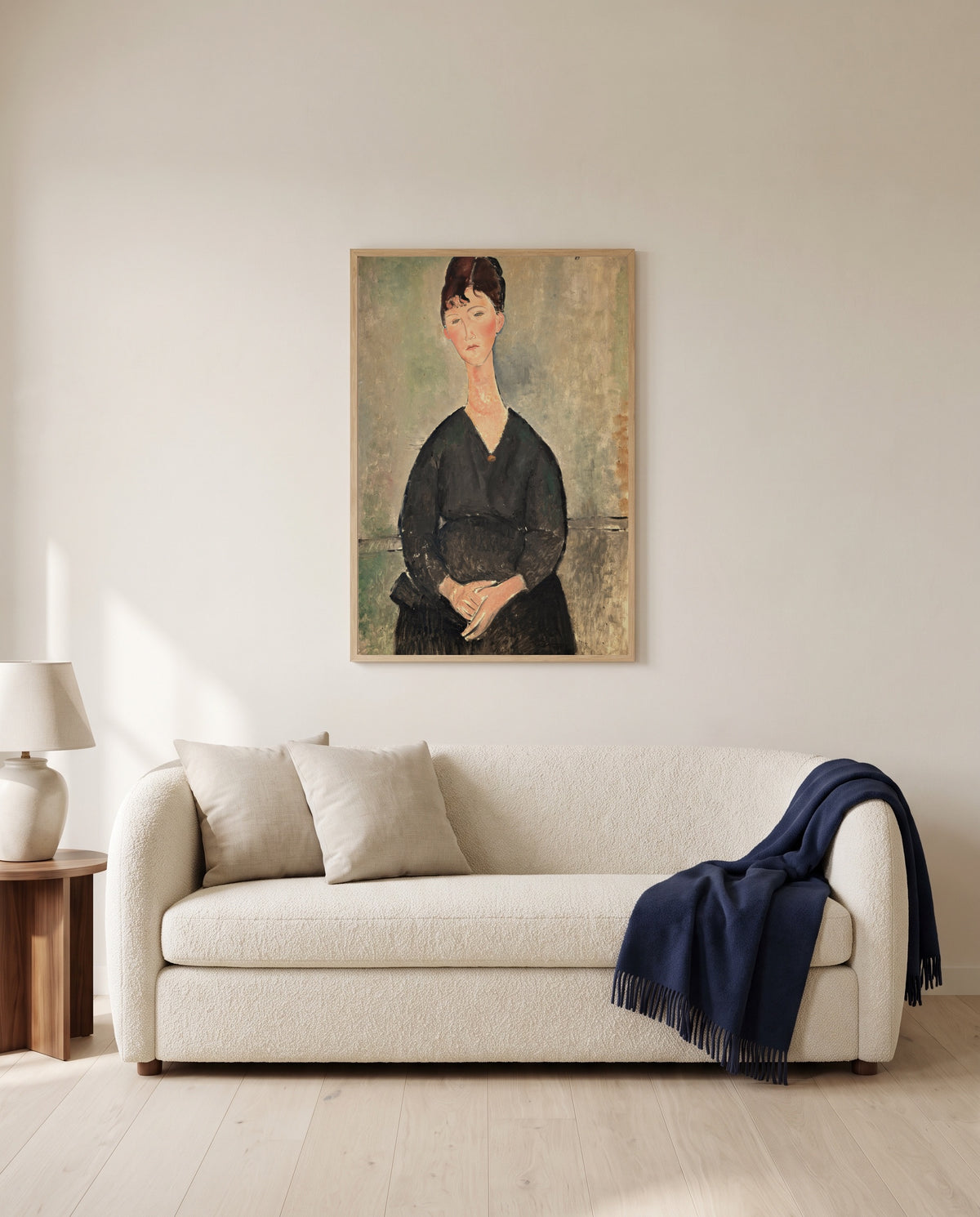 Café Singer by Amedeo Modigliani framed in natural oak above a cream sofa in a warm living room